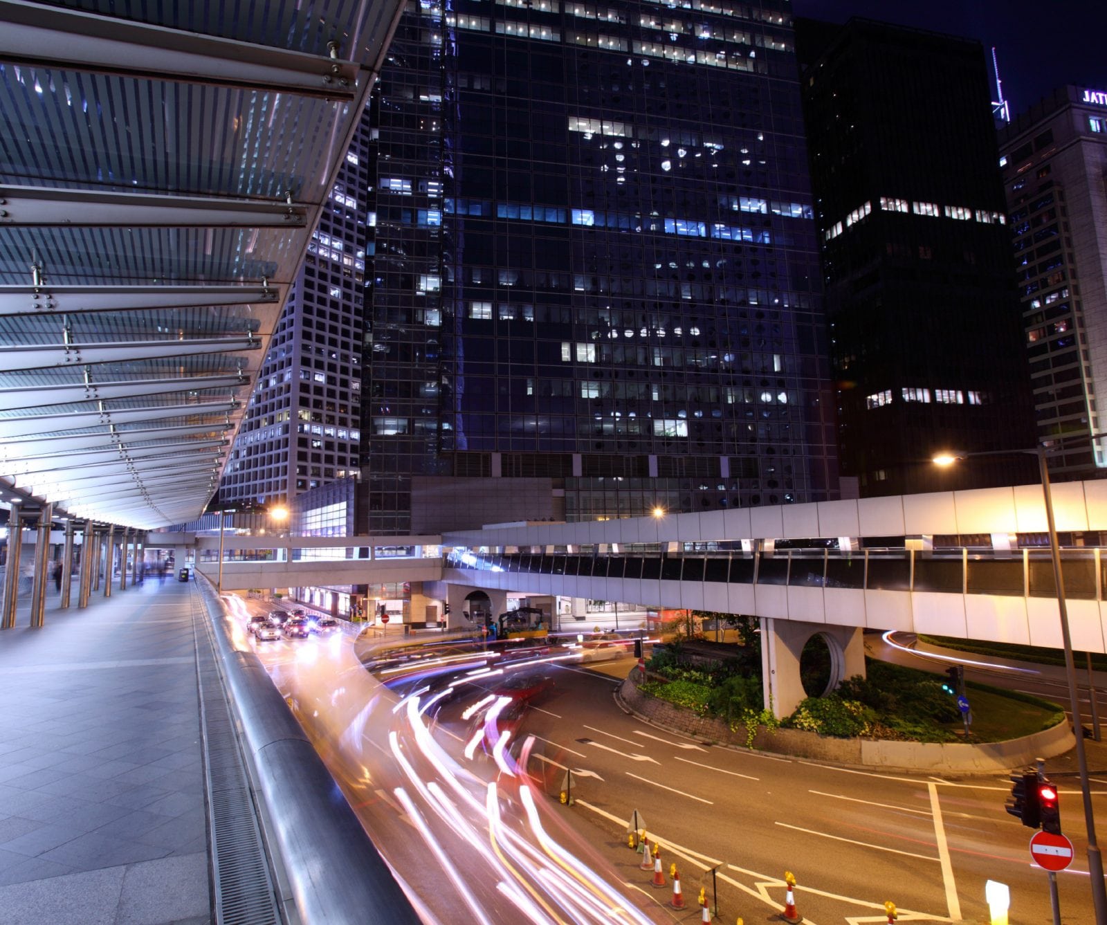Cars driving on highway at night downtown