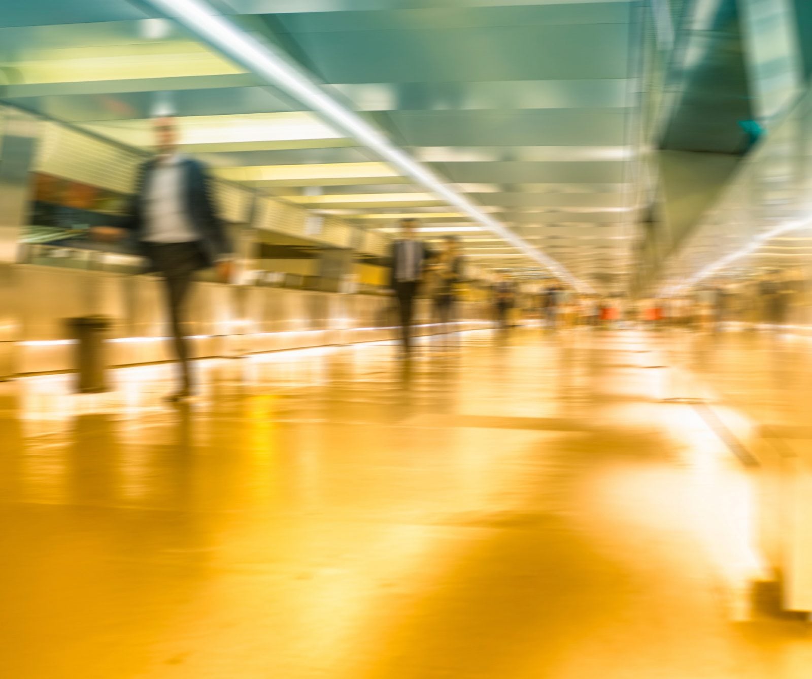 People walking by in a station